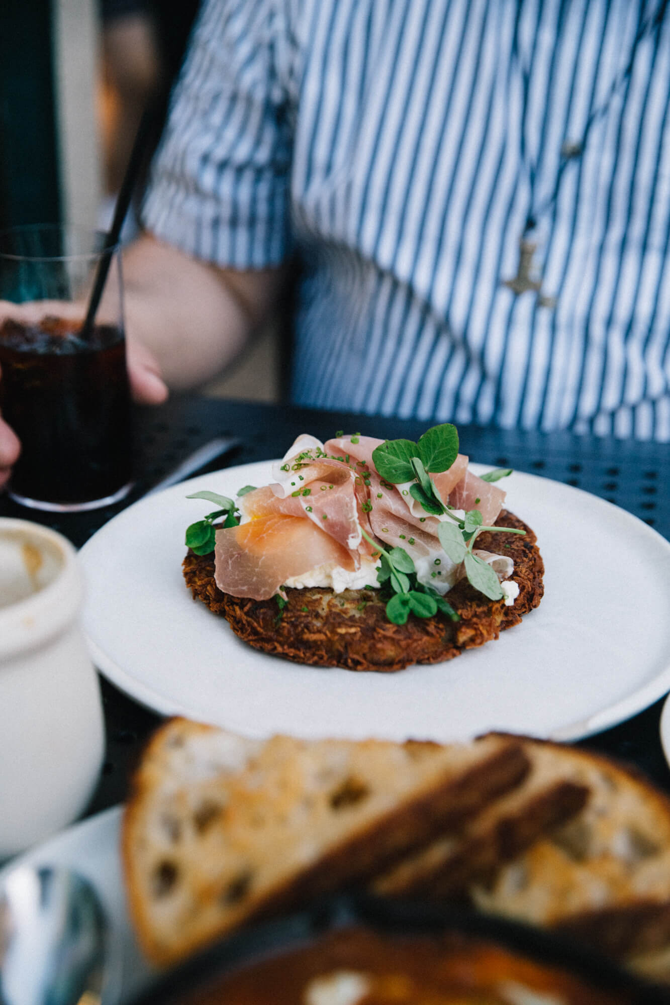 Gourmet brunch with smoked salmon and herbs, perfect with Santa Lucia Highlands wine.