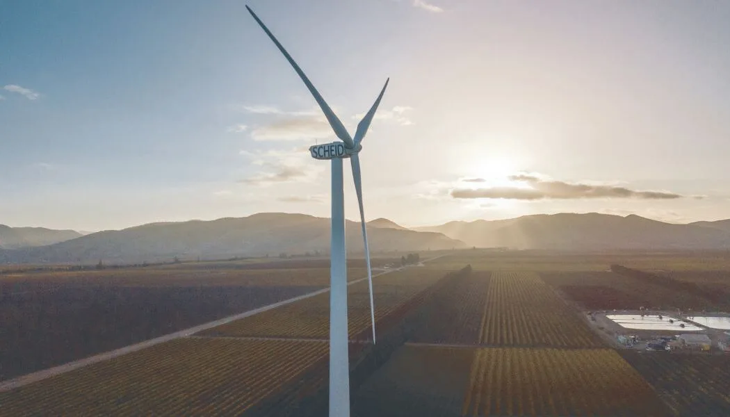 Scheid Vineyards wind turbine in Santa Lucia Highlands, Monterey County, CA, at sunset.