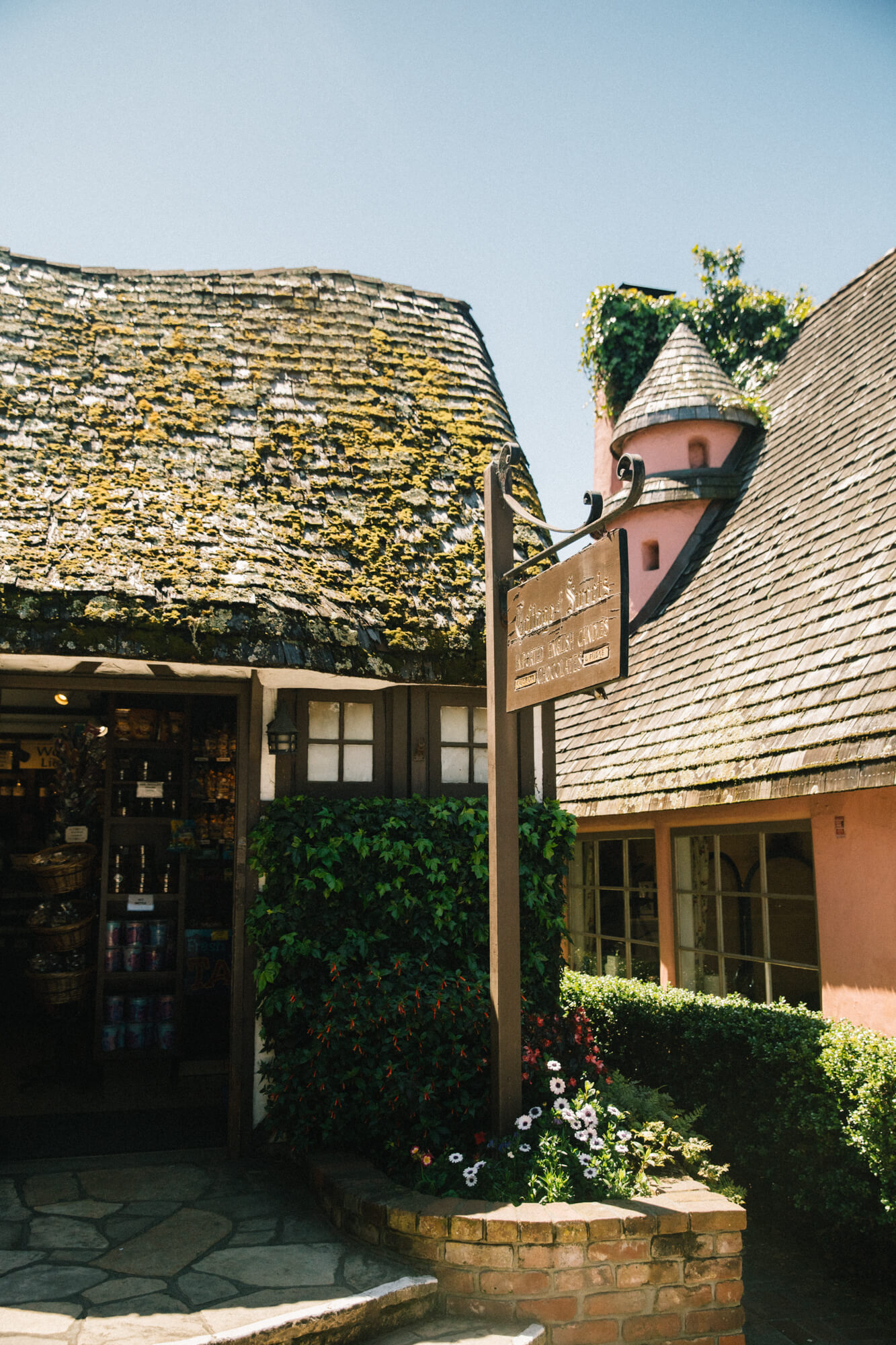 Charming shop with whimsical architecture and a sign for "Whimsy & Soul" in Santa Lucia Highlands.