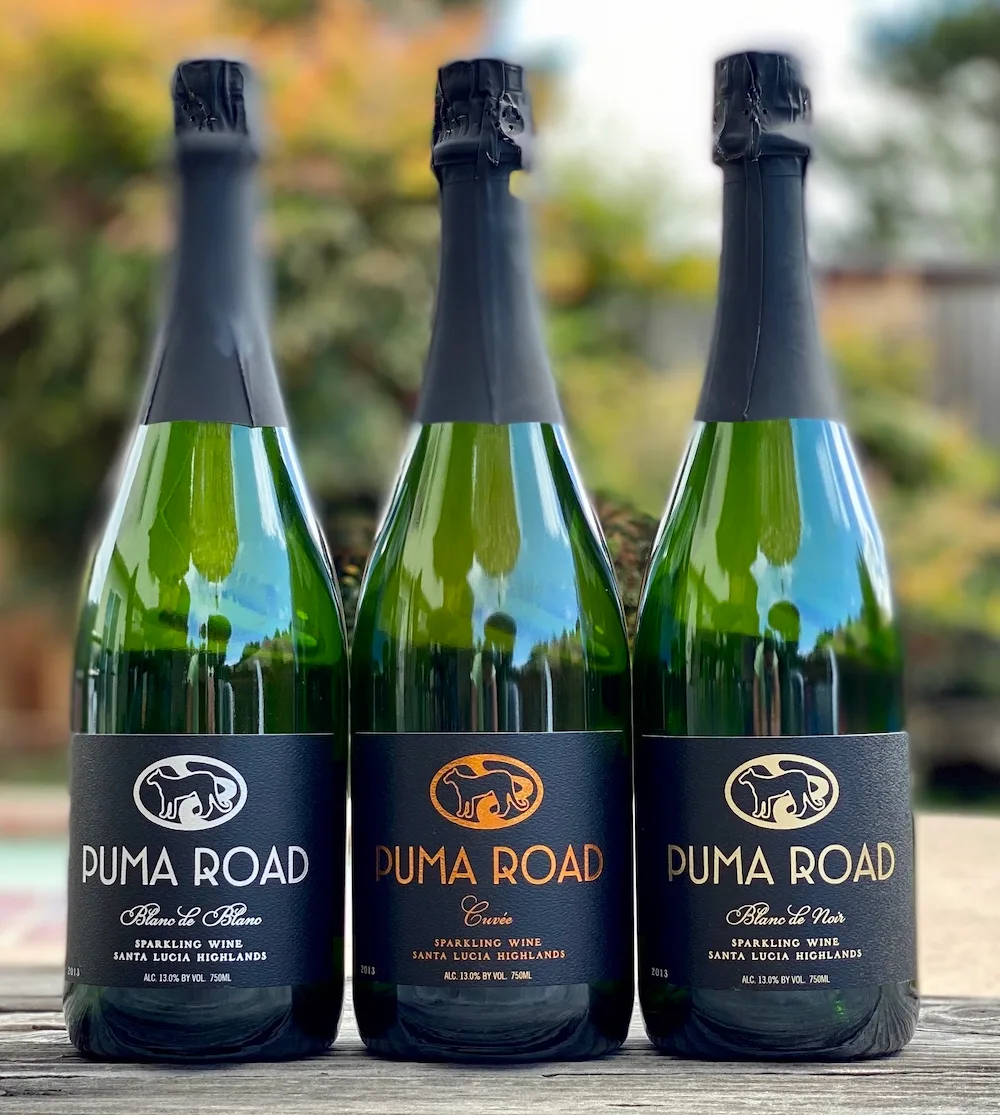 Three bottles of Puma Road sparkling wine from Santa Lucia Highlands, California.
