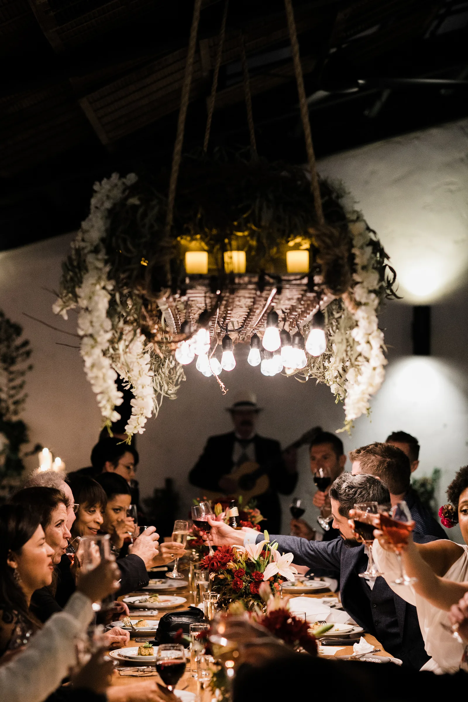 Folktale Winery guests toast at a festive dinner in Carmel Valley, Monterey County.