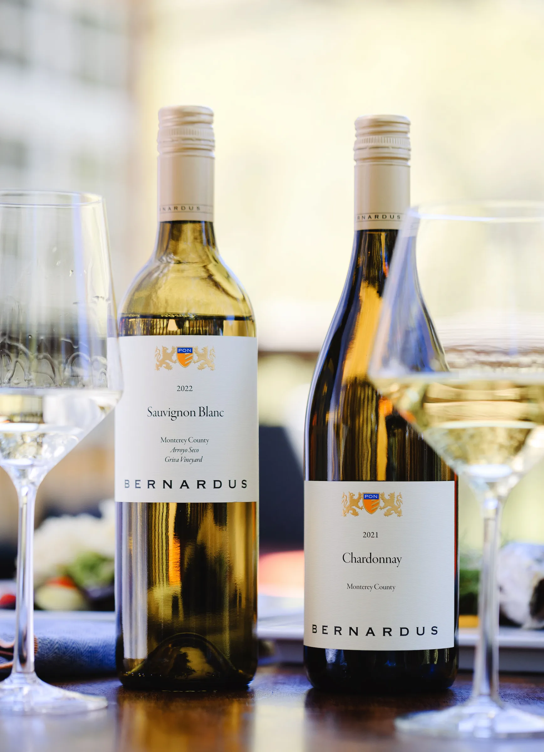 Two bottles of Bernardus wine, Sauvignon Blanc and Chardonnay, from Santa Lucia Highlands.