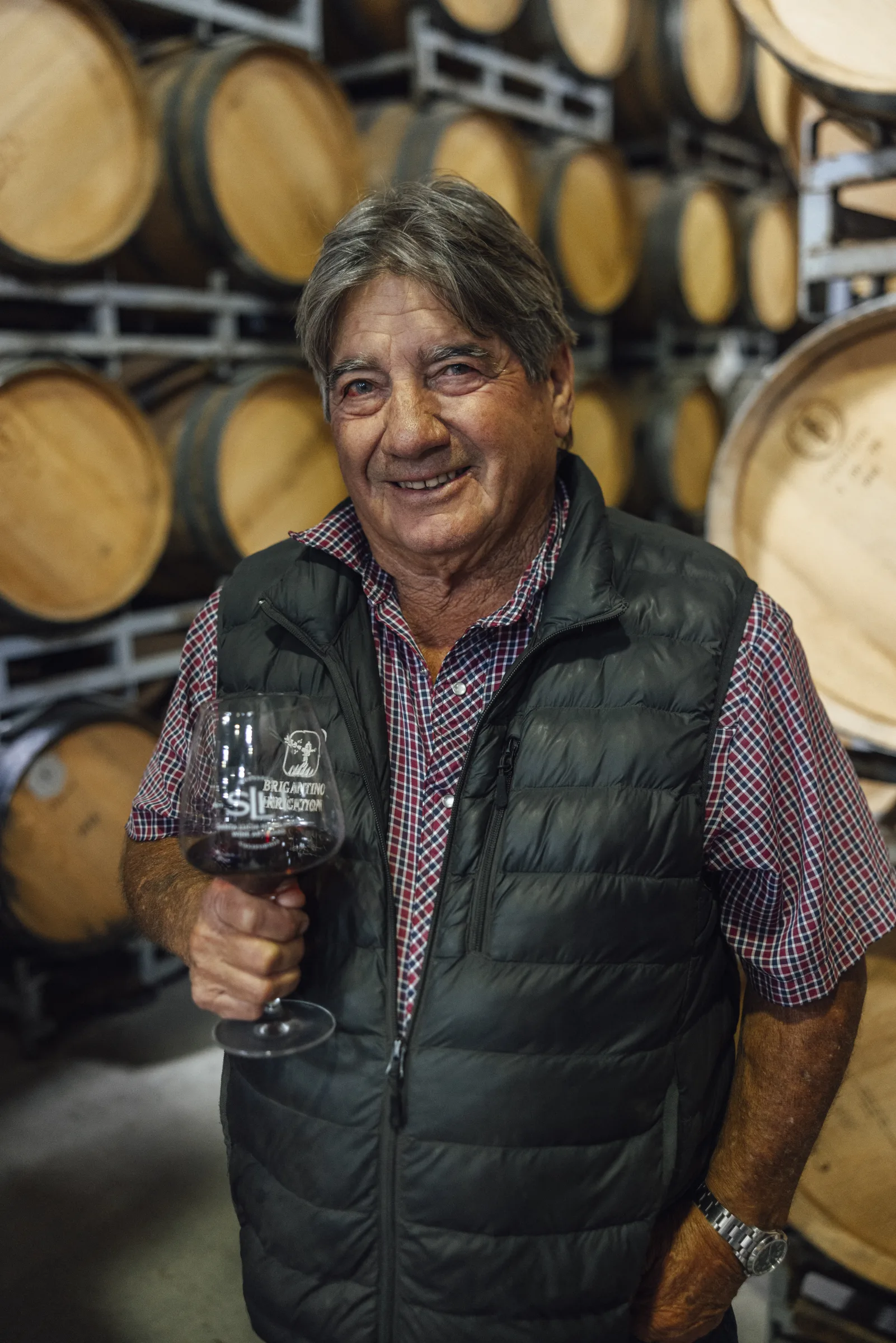 Ray Franscioni of Pessagno Winery in Santa Lucia Highlands, California, holds a glass of wine.
