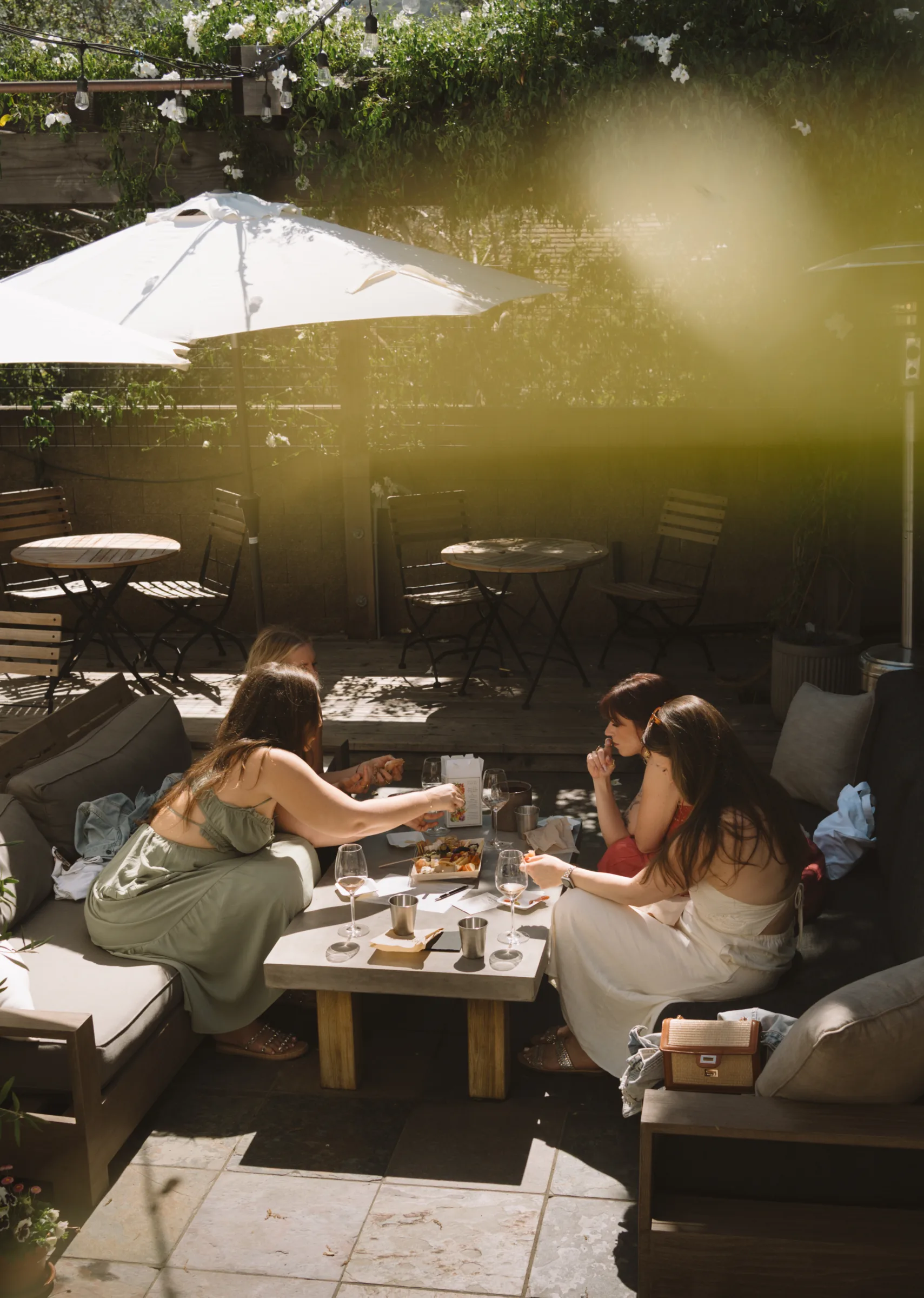 Friends enjoy wine tasting and appetizers at Corral Wine Co. in Carmel Valley, Monterey County.