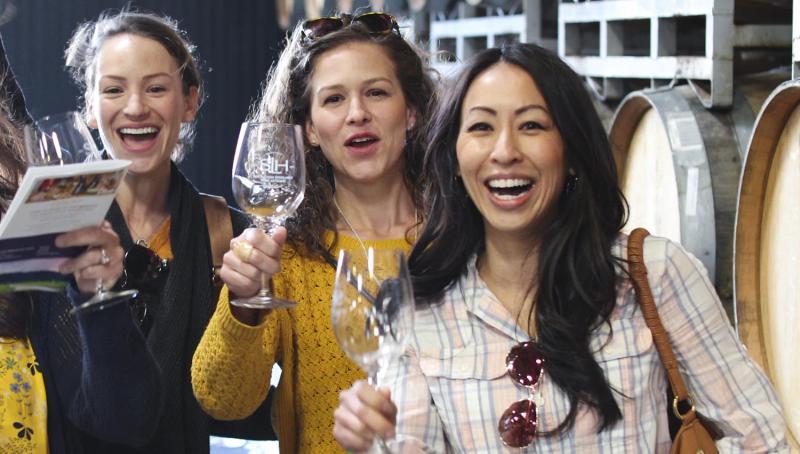 Guests enjoying wine tasting at a Santa Lucia Highlands winery.