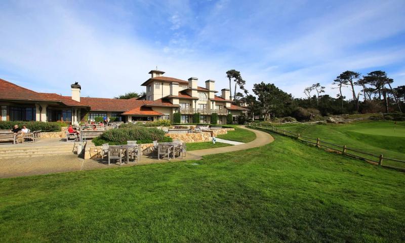 The Inn at Spanish Bay with outdoor seating and golf course at Pebble Beach, California.