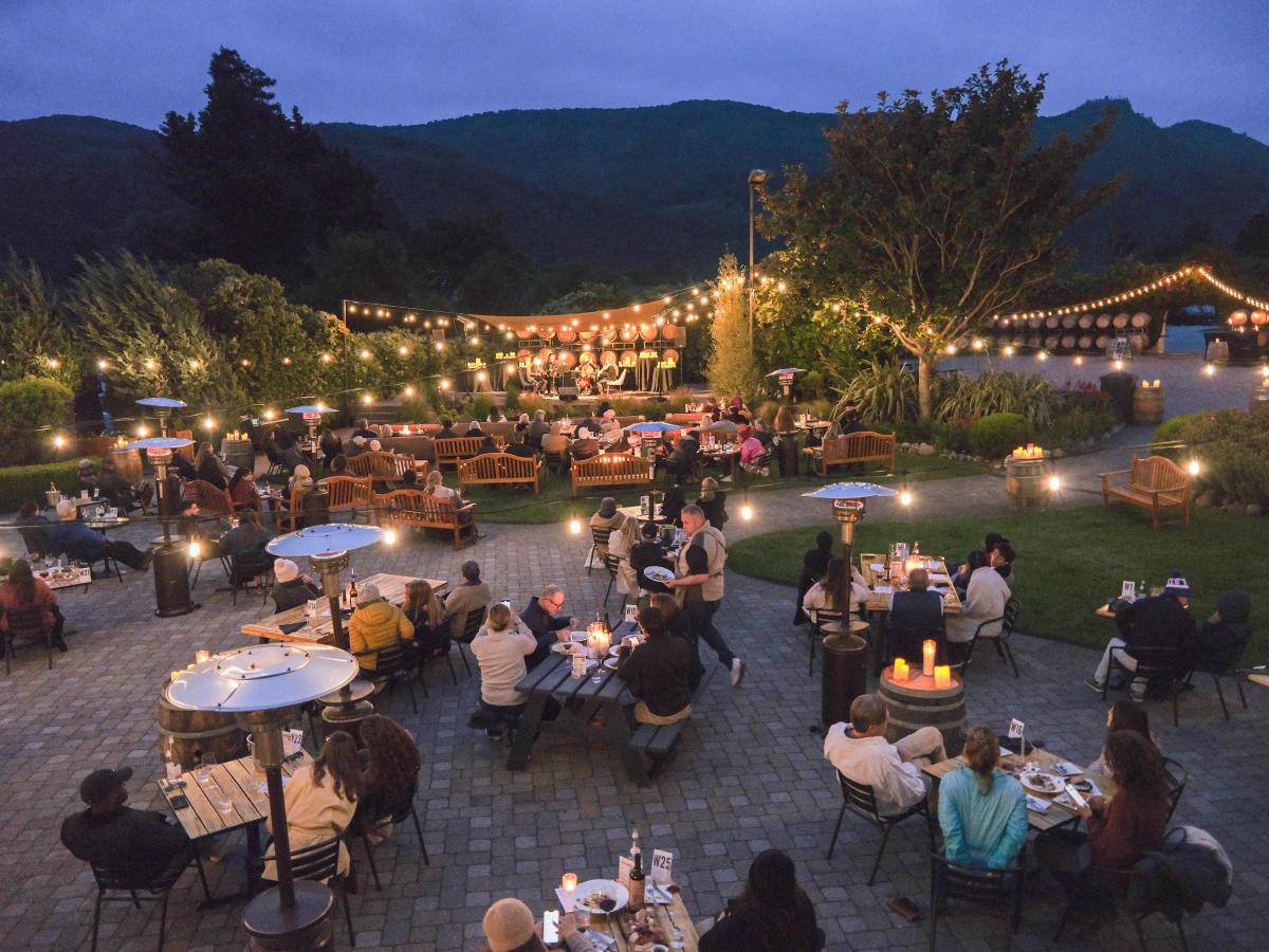 Folktale Winery tasting room in Carmel Valley, Monterey County, hosts an evening event with live music.