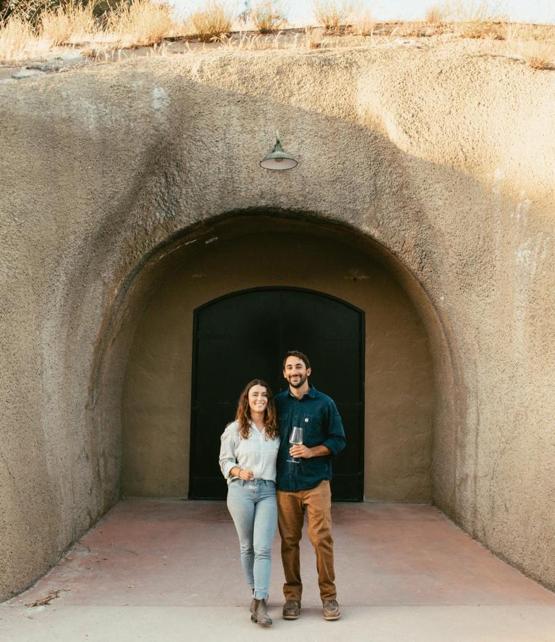 Sydney and Greg in front of Tira Nanza winery, the Tira Nanza tasting room is in Carmel by the Sea.