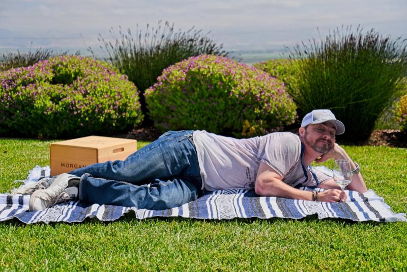Ramy Husseini relaxes with a wine glass at Morgan Double L Ranch, Santa Lucia Highlands.