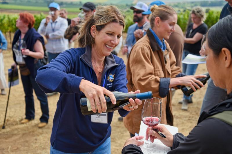 Sommelier pours wine at Morgan Wines Double L Ranch, Santa Lucia Highlands.