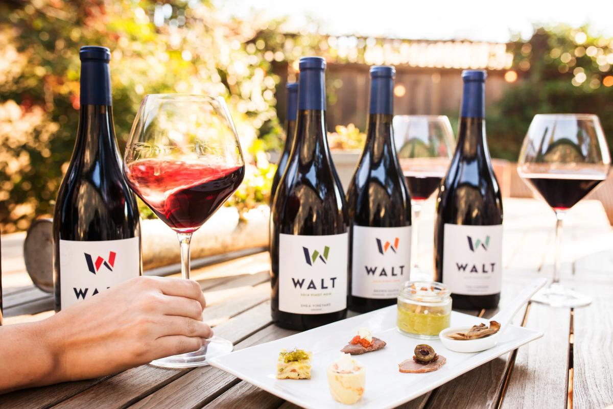 WALT Wines tasting flight with bottles and small bites in Napa and Sonoma tasting rooms.