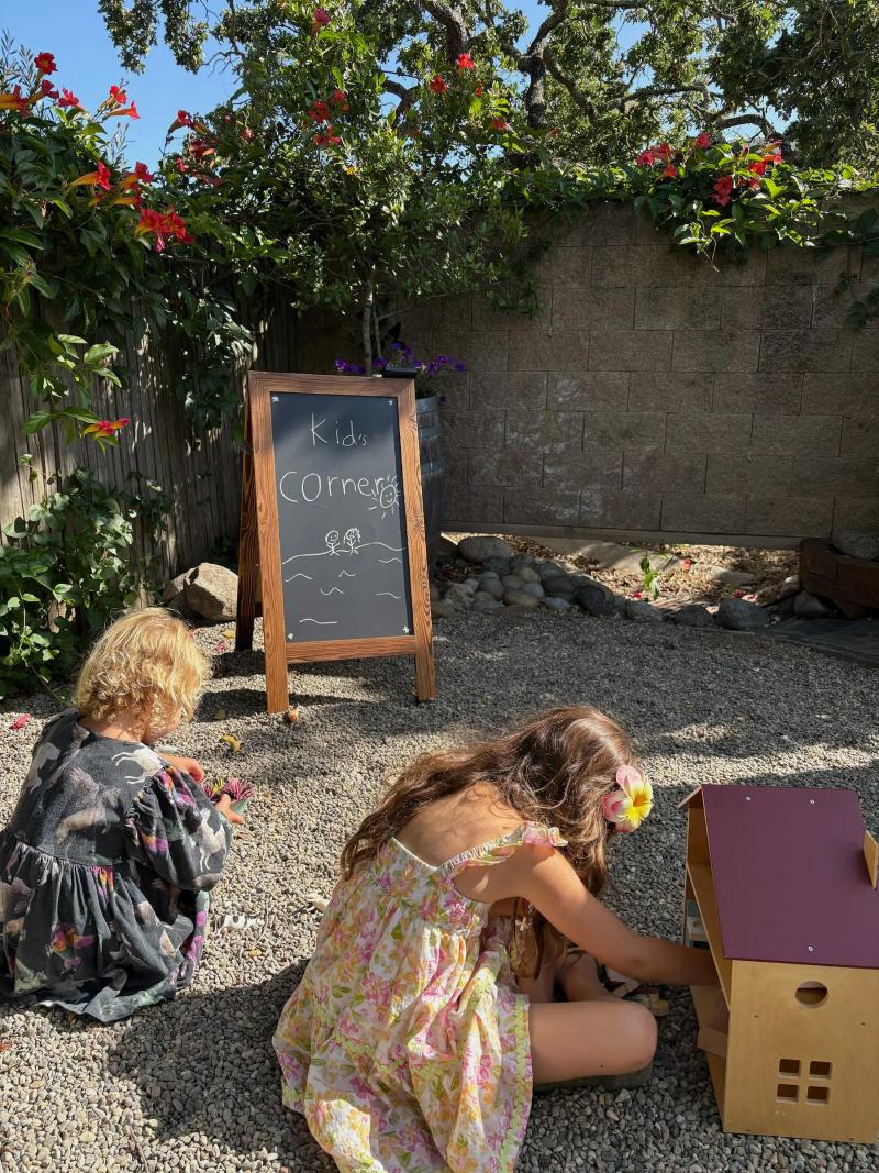 The Kids Corner at Corral wIne Company provides toys and a safe play area closeby lounge seating and tables at the tasting room patio.