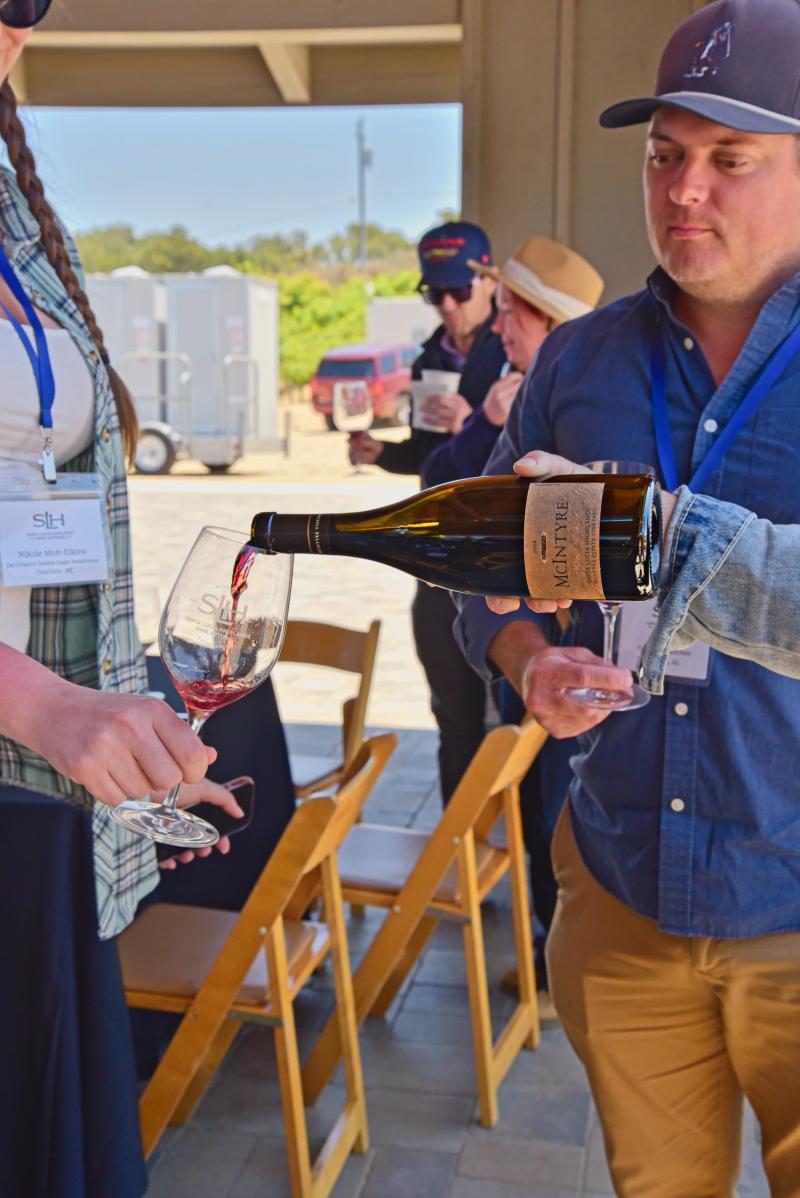 McIntyre Wines sommelier pours wine at an education event in Santa Lucia Highlands, Monterey County.