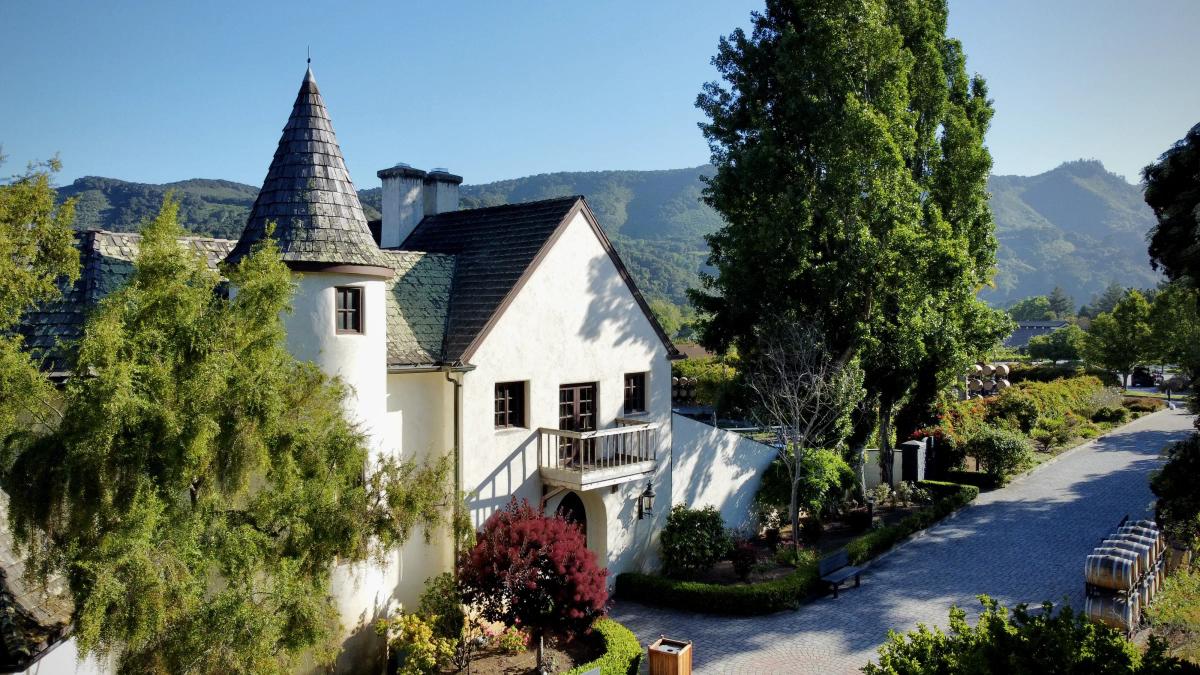 Folktale Winery tasting room with turret and vineyard views in Carmel Valley, Monterey County.