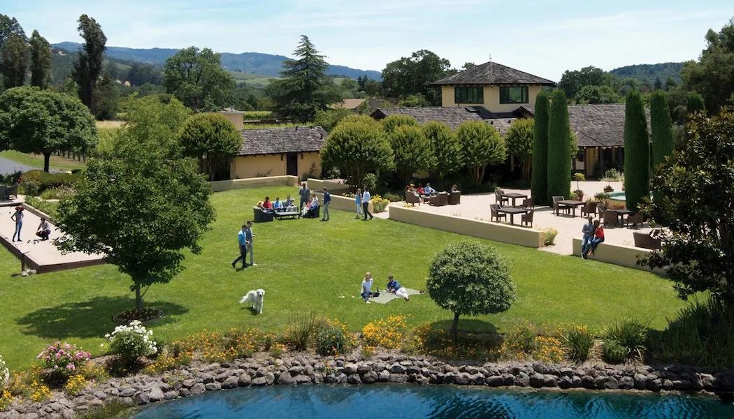 Landmark Vineyards in Kenwood winery with people enjoying bocce ball, lawn, and patio.