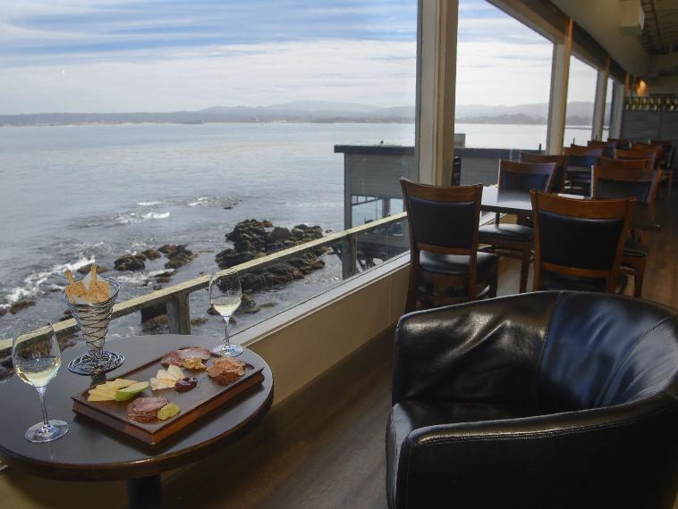 Wine and charcuterie board with ocean view at Cannery Row, Monterey.