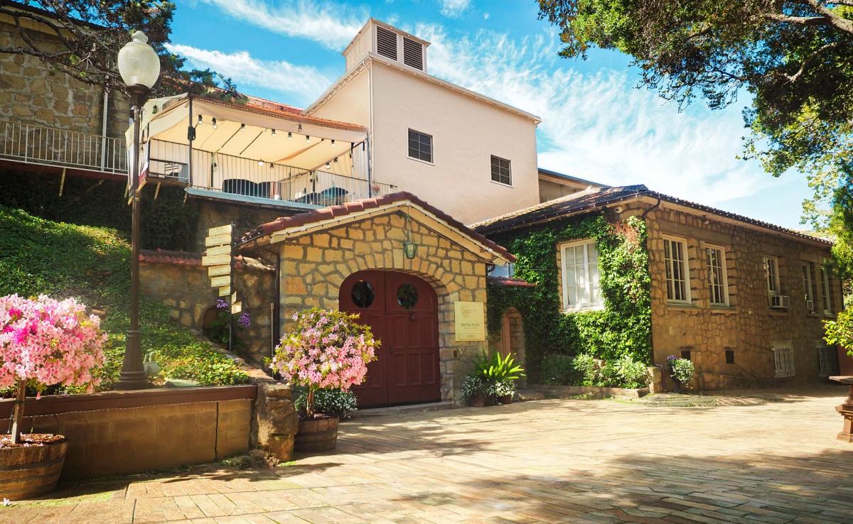 Testarossa Winery in Los Gatos CA with stone and ivy accents under a sunny sky.