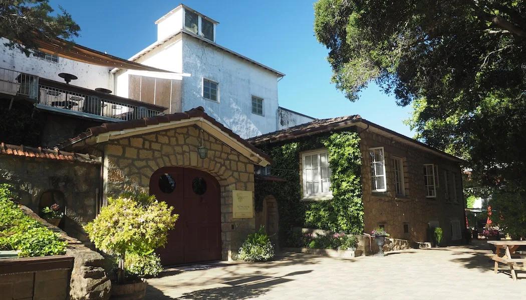 Testarossa Winery in Los Gatos CA with stone and ivy accents under a sunny sky.