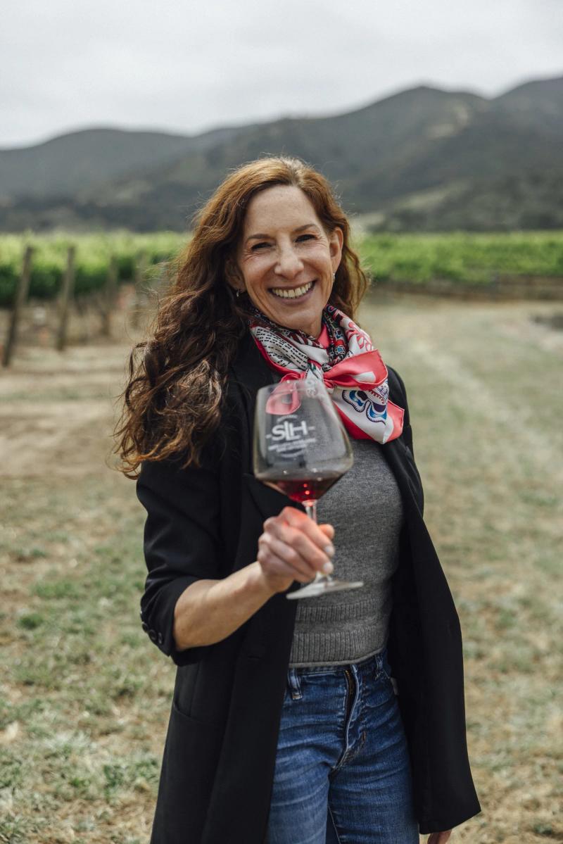 Kerith Overstreet, owner/winemaker of Bruliam Wines, holds a glass of wine in Santa Lucia Highlands.