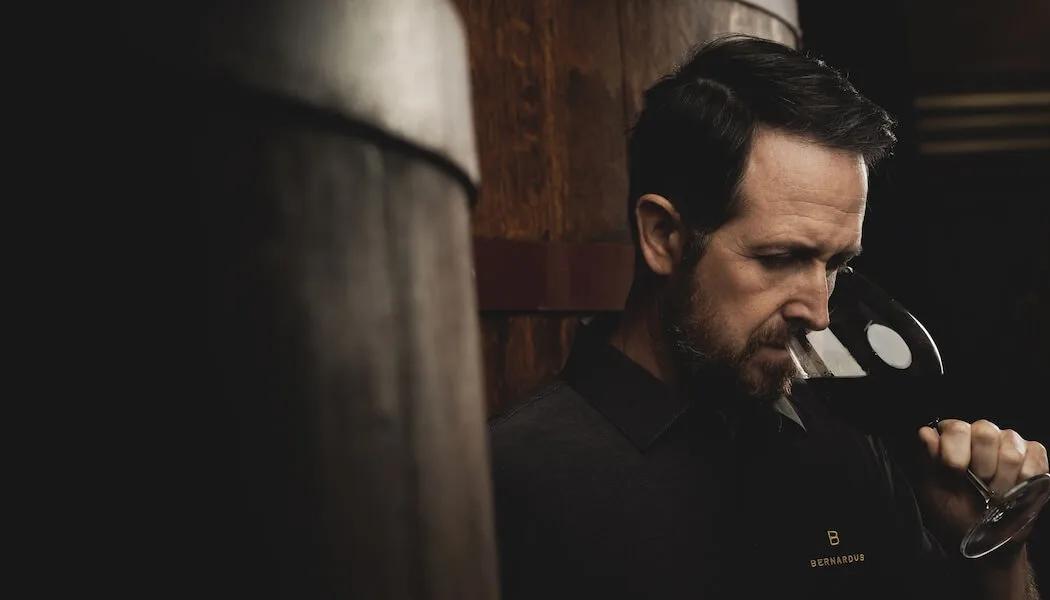 Jim McCabe of Santa Lucia Highlands, Monterey County, California, tastes wine in a cellar.
