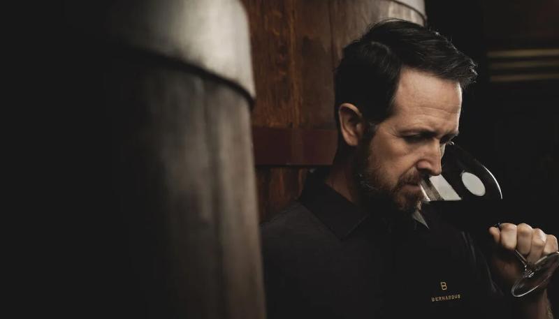 Jim McCabe of Santa Lucia Highlands, Monterey County, California, tastes wine in a cellar.